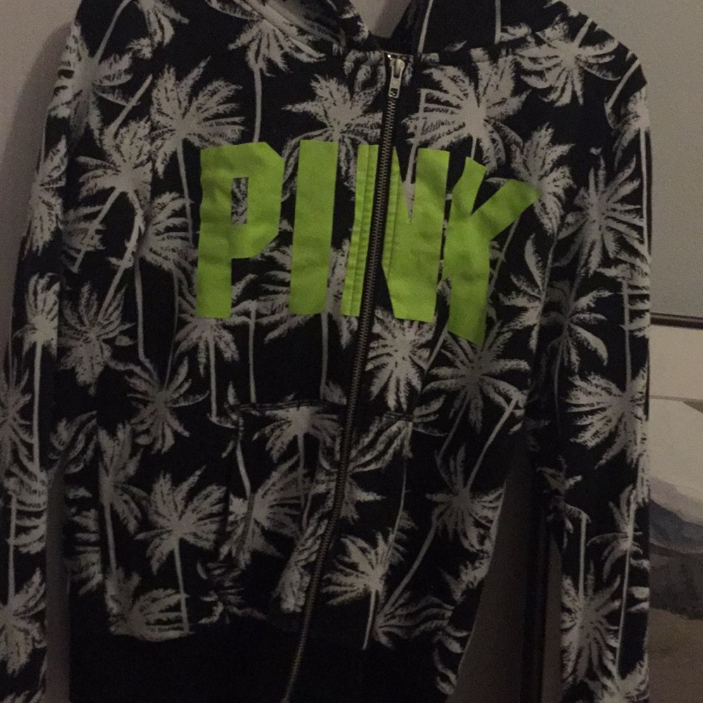 A PINK sweater with palm trees
